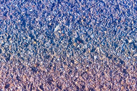 Old asphalt with blue-red gradient overlay Stock-Fotos
