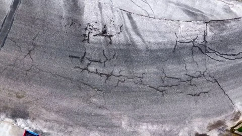 Old asphalt road in poor condition. Stock Footage 332810826