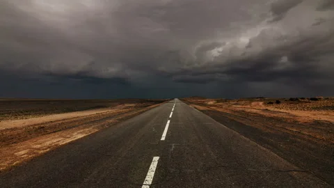 Old asphalt road at storm clouds background. 4K TimeLapse. Stock Footage 100097087