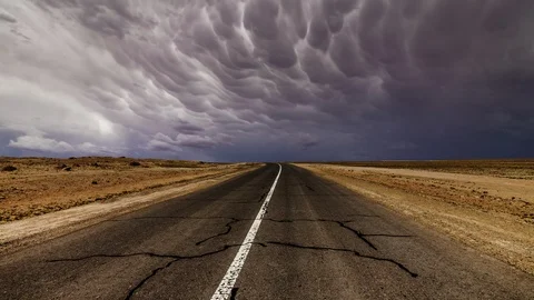 Old asphalt road at storm clouds background. TimeLapse. Stock Footage 116719958