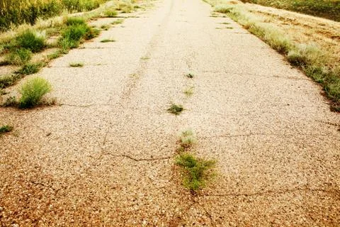 Old asphalted thrown road Stock Photos