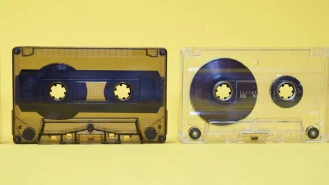 Old audio cassettes on a yellow background Stock Footage 331455489