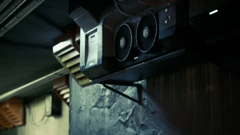 Old audio equipment mounted on a wall in a dimly lit underground space Stock Footage 331418321