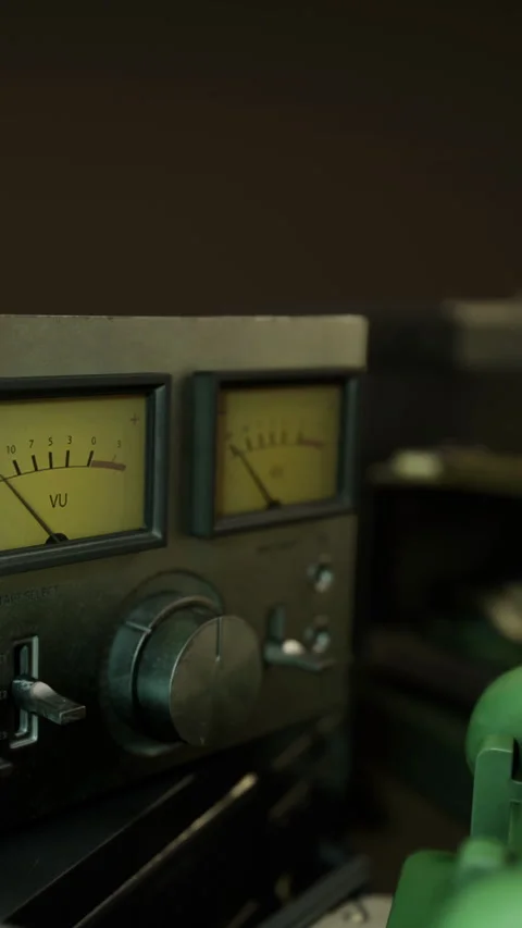 Old audio equipment shows dials and knobs in close up view at a studio Stock Footage 333567663