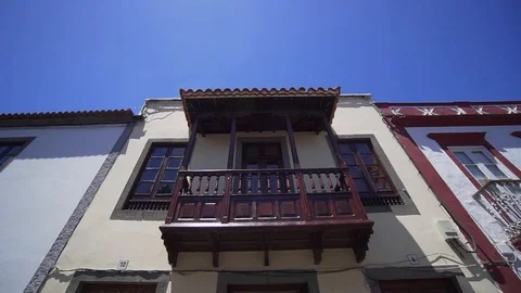Old authentic balcony on the facade of a spanish building. European city Stock Footage 117171161