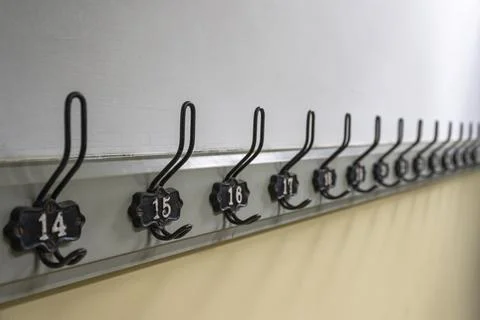 Old authentic coat rack in a historic building in the Netherlands. Stock Photos