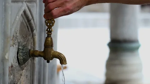 Old authentic iron faucet in the mosque Stock Footage 99378512