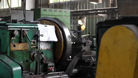 An old automatic lathe, on which a large product is turned out of metal. Stock Footage 241935085