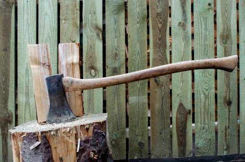 Old Axe Stuck in Wood Stock Photos
