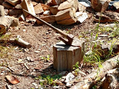 Old axe on stump Stock Photos