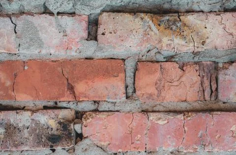Old background with rough red bricks, grunge rough wall surface, dirty weathe Stock Photos