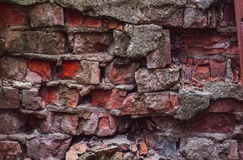 Old background with rough red bricks, grunge rough wall surface, dirty weathe Stock Photos