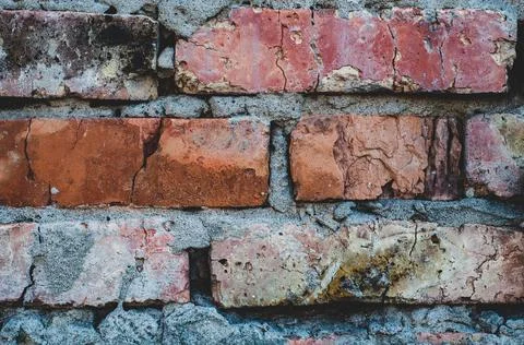 Old background with rough red bricks, grunge rough wall surface, dirty weathe Stock Photos