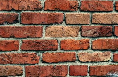 Old background with rough red bricks, grunge rough wall surface, dirty weathe Stock Photos
