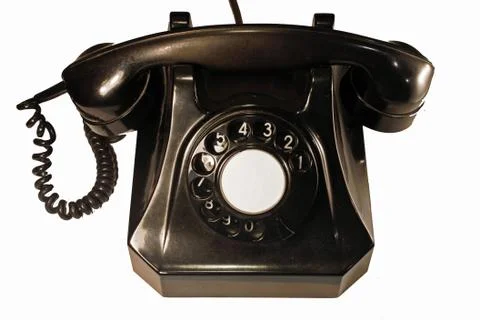 Old bakelite telephone with classical dial. Isolated on white background Stock Photos