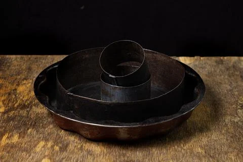 Old baking dishes. Forms for cake layers.  Stock Photos