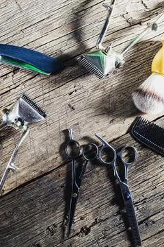 Old barber tools on rustic wooden weathered background Stock Photos