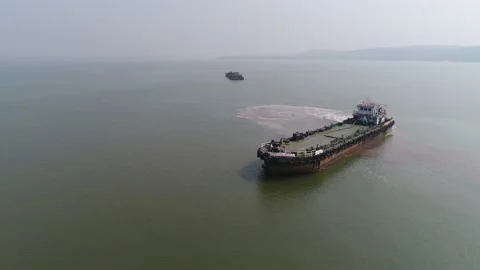 Old barge change course in the sea. Aerial view. 스톡 동영상 85637151