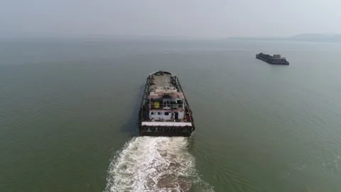 The old barge moves into the sea. View from the stern. Shooting with a drone. Stock-Footage 85657697