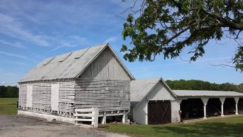 Old barn and farm buildings in the countryside Stock Footage 338034696