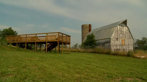 Old Barn and Silo with modern deck Stock Footage 35484287