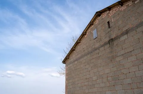 Old barn with bright blue sky in the background Stock Photos
