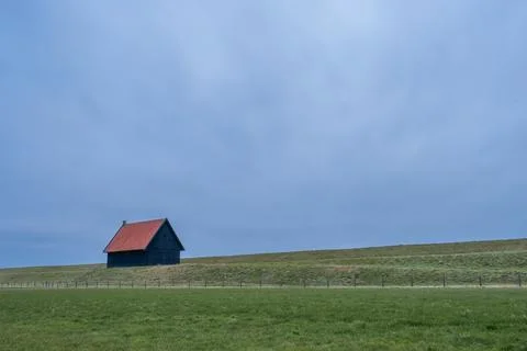Old barn at the coast of Wieringerwerf, The Netherlands. Stock Photos