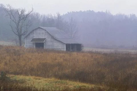 Old barn in field 스톡 사진