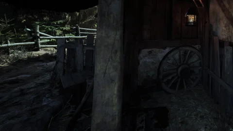 Old barn interior with wooden structures and a wagon wheel Stock Footage 344408391