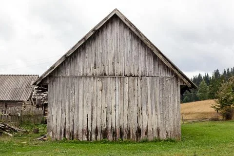 Old barn made of vertical planks. Stock Photos