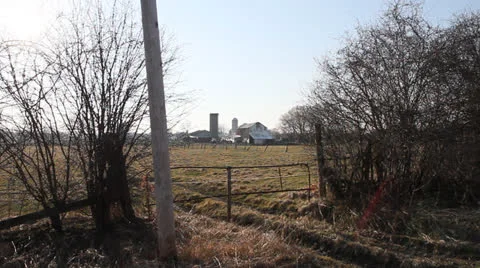 Old barn with peeling paint, wire fence and gate. HD 1080p 24fps. Stock Footage 22775194