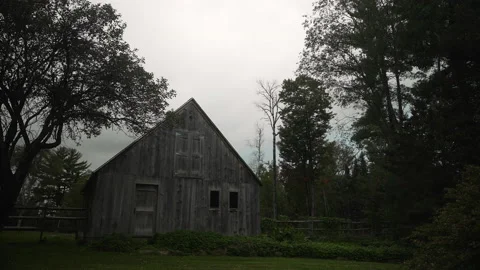 Old barn in rural setting with lush green landscape vintage fence 4k 60fps Stock Footage 162784115