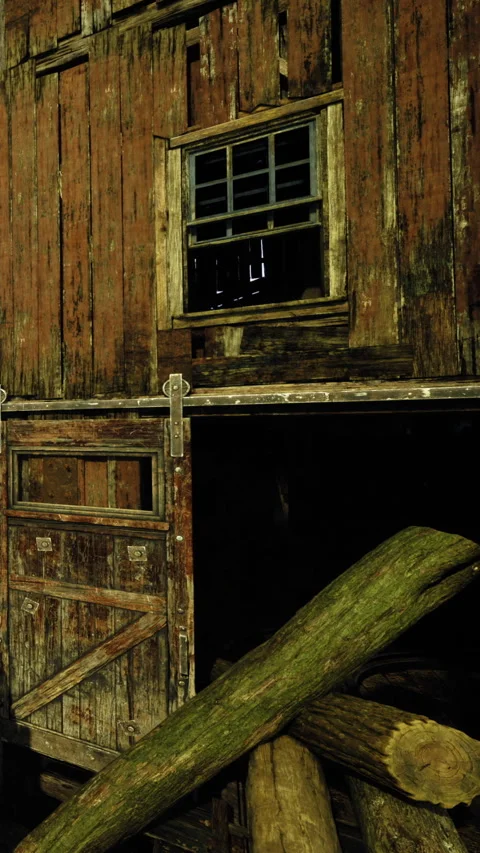 Old barn structure with wooden door and window in rural area at night Stock Footage 334172963