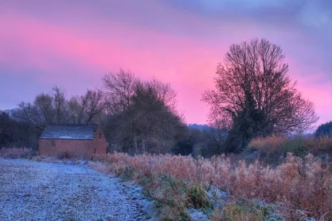 Old barn at sunset Stock Photos