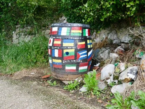 Old barrel with painted flags of nations Stock Photos
