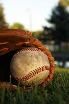 Old Baseball In a Mitt Stock Photos