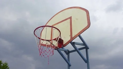Old basketball hoop and board on blue sky Stock Footage