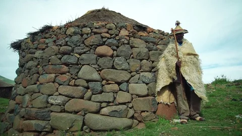 Old Basotho man intraditinal clothes staning in front of homestead,Lesotho Stock Footage 73228009