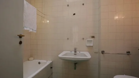 Old bathroom interior with artificial light, nobody Stock Footage 72342061