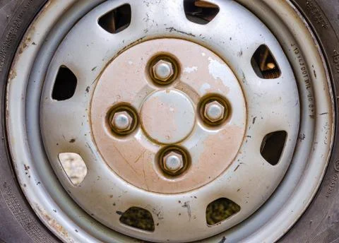 Old, battered car wheel Stock Photos