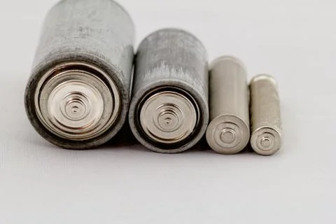 Old batteries on white background Stock Photos