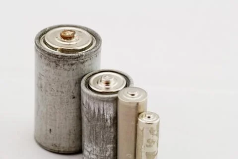 Old batteries on white background Stock Photos