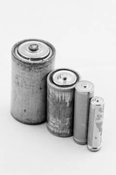Old batteries on white background Stock Photos