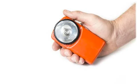 Old battery flashlight on the white background Stock Photos