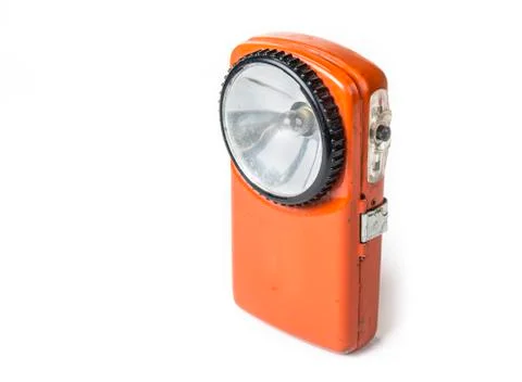 Old battery flashlight on the white background Stock Photos