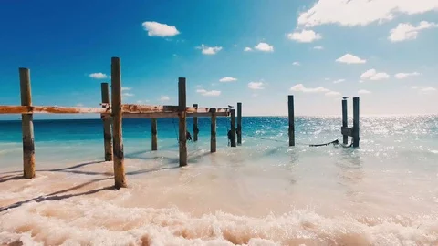 Old Beach Dock Over Tropical Water at Taino Beach, Freeport Stock Footage 98517522