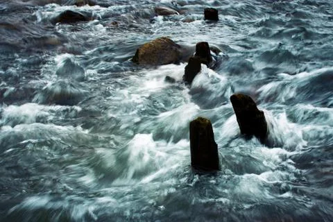 Old beams in the river Stock Photos