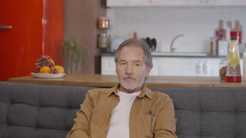 The old bearded man speaks to someone. Stock Footage 148676200