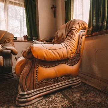 Old beautiful yellow sofas in an abandoned house Stock Photos