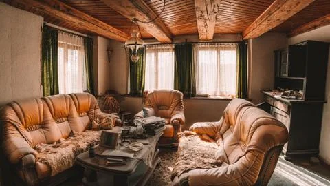 Old beautiful yellow sofas in an abandoned house Stock Photos